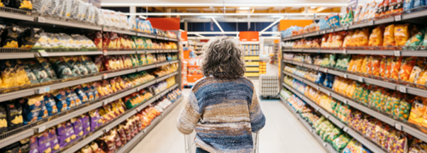Customer shopping in a supermarket aisle, representing an accident in supermarket compensation claim scenario.